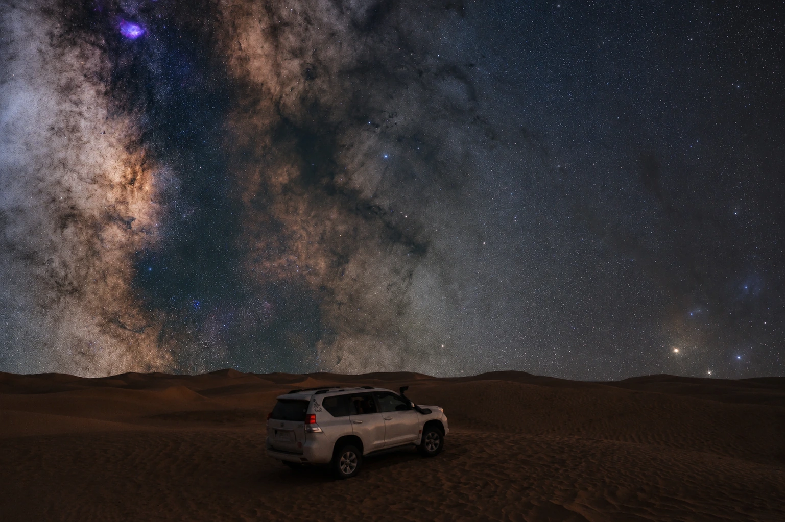A 4x4 camp beneath the stars in Al Qua'a.