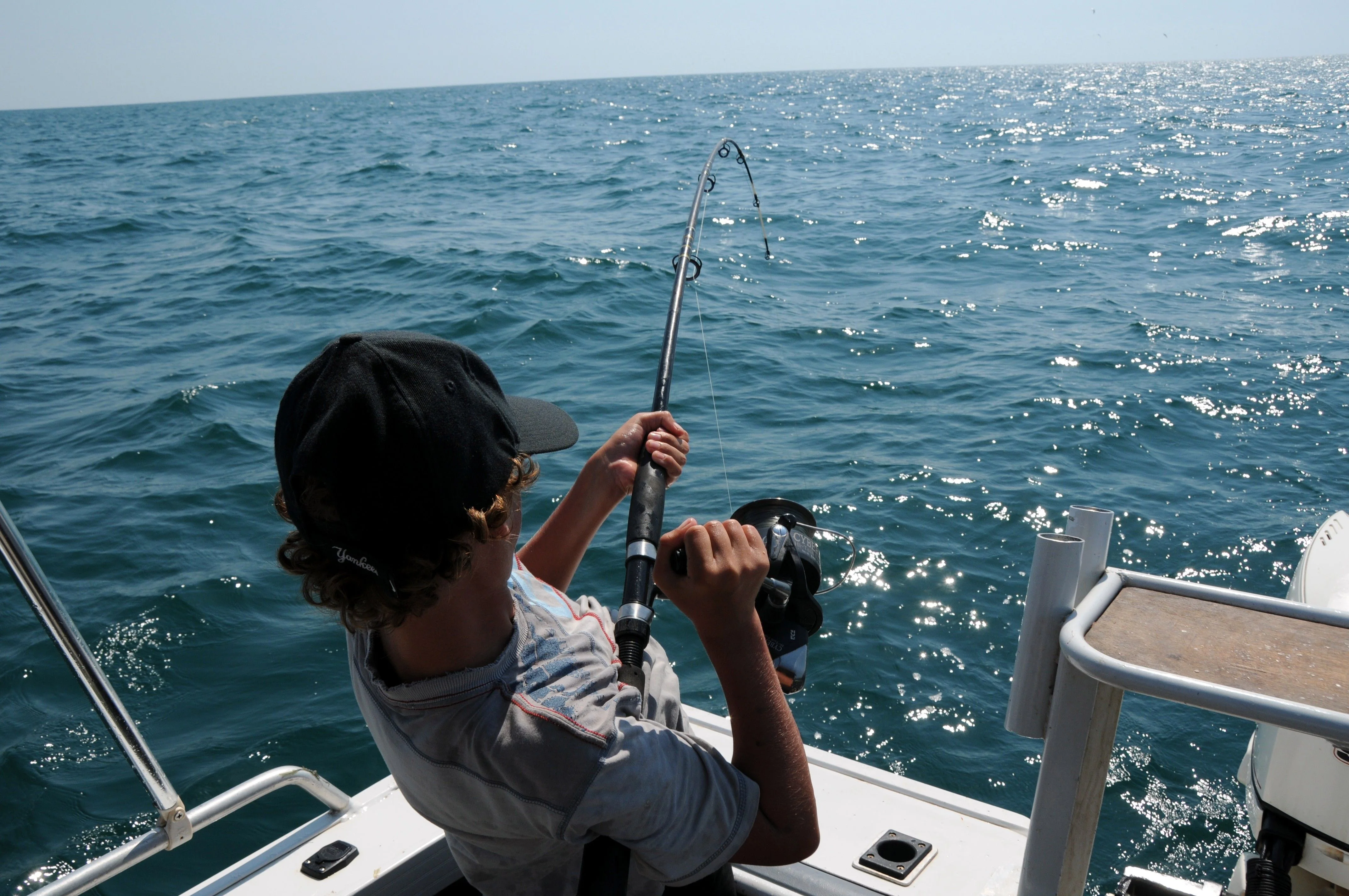 A guest fishing from a boat on the sea in Abu Dhabi
