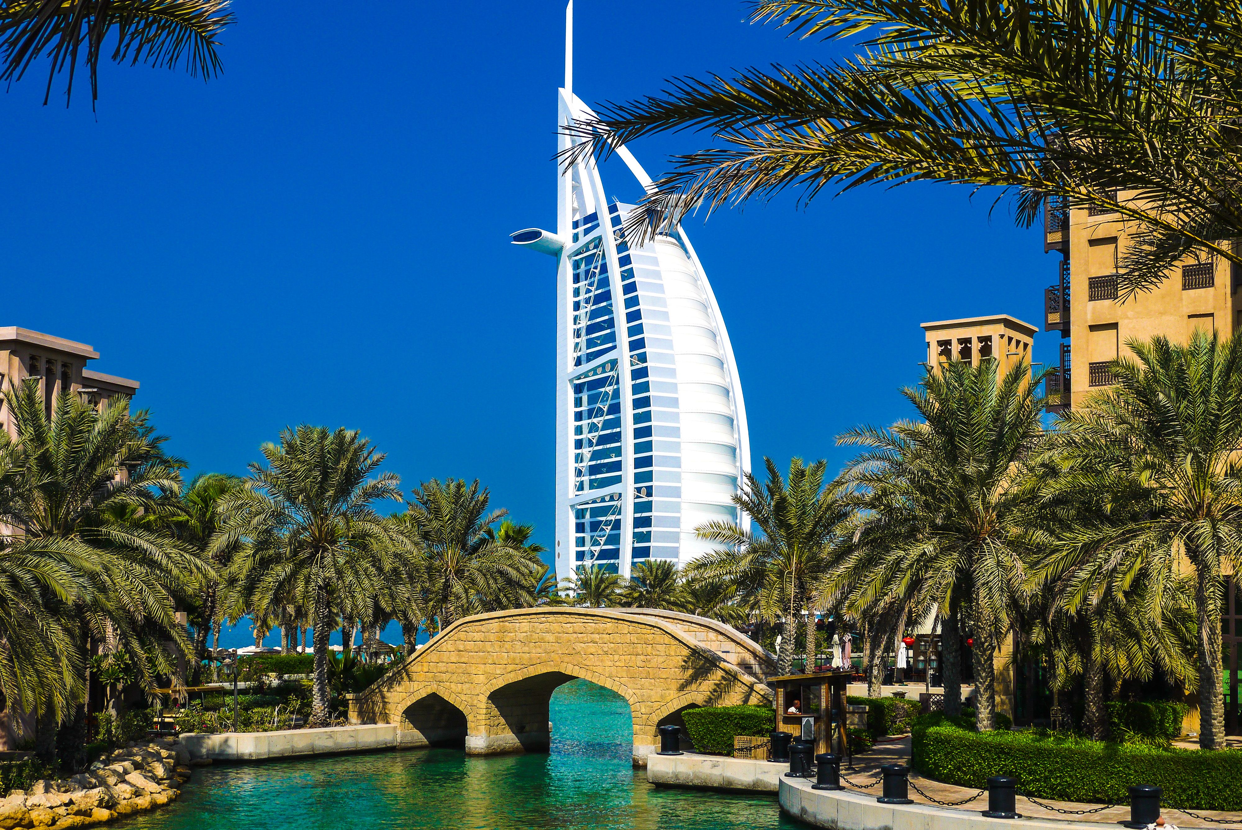 Burj Al Arab framed by palms and water, representing polished travel planning with ARVY.