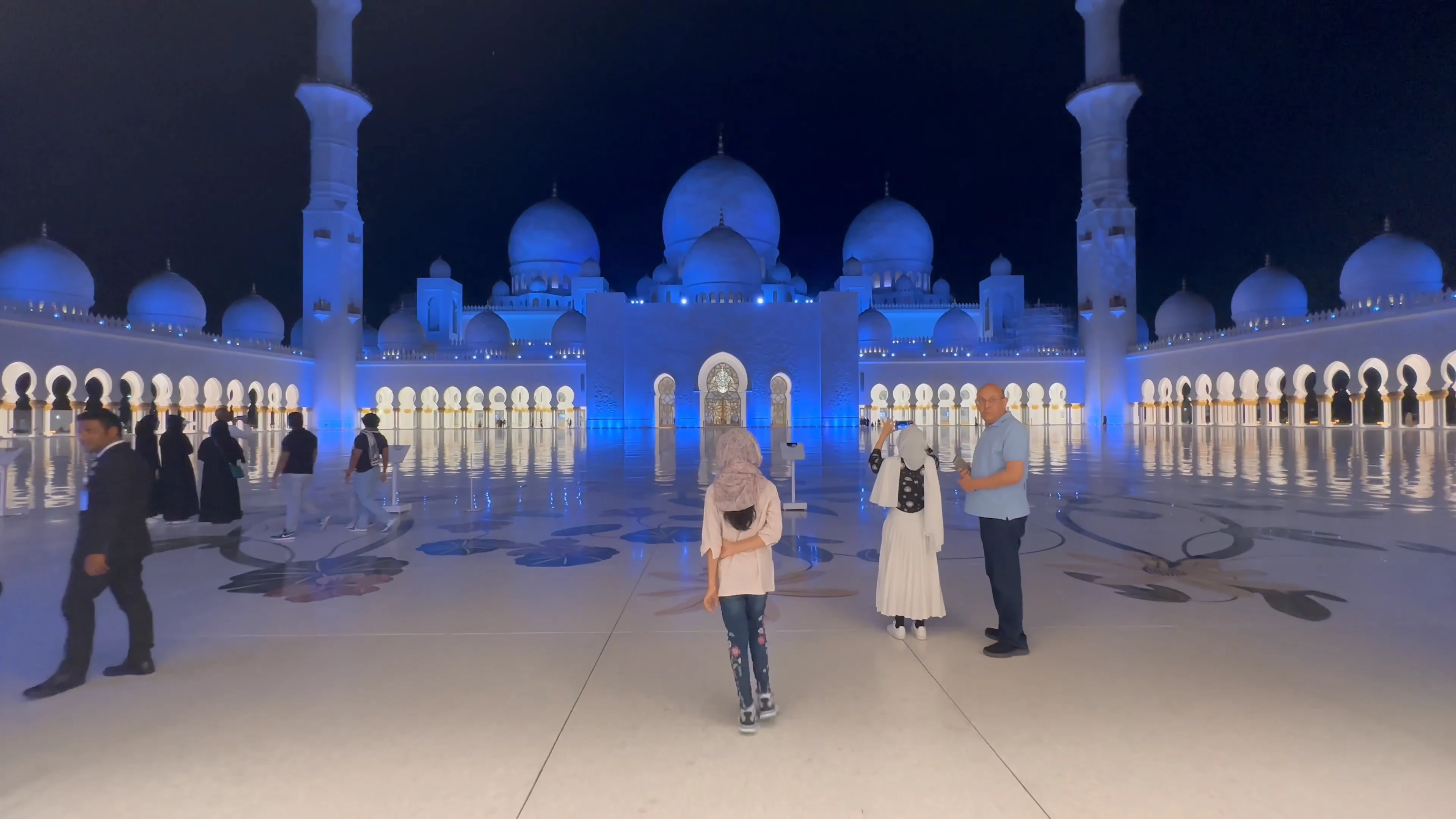 Visitors at Sheikh Zayed Grand Mosque during an Abu Dhabi full-day city tour.